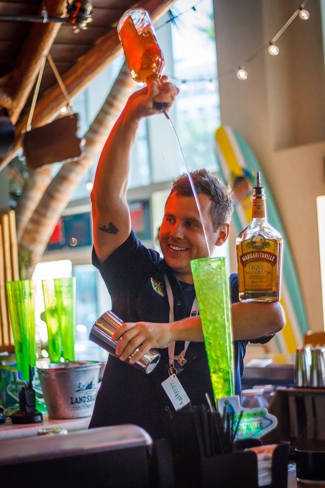 Flair bartender pouring a long tequila stream at Fuel Bar Las Vegas
