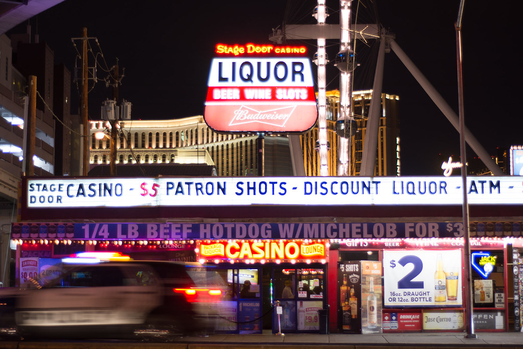 Neon liquor marquee of Stage Door Casino at night