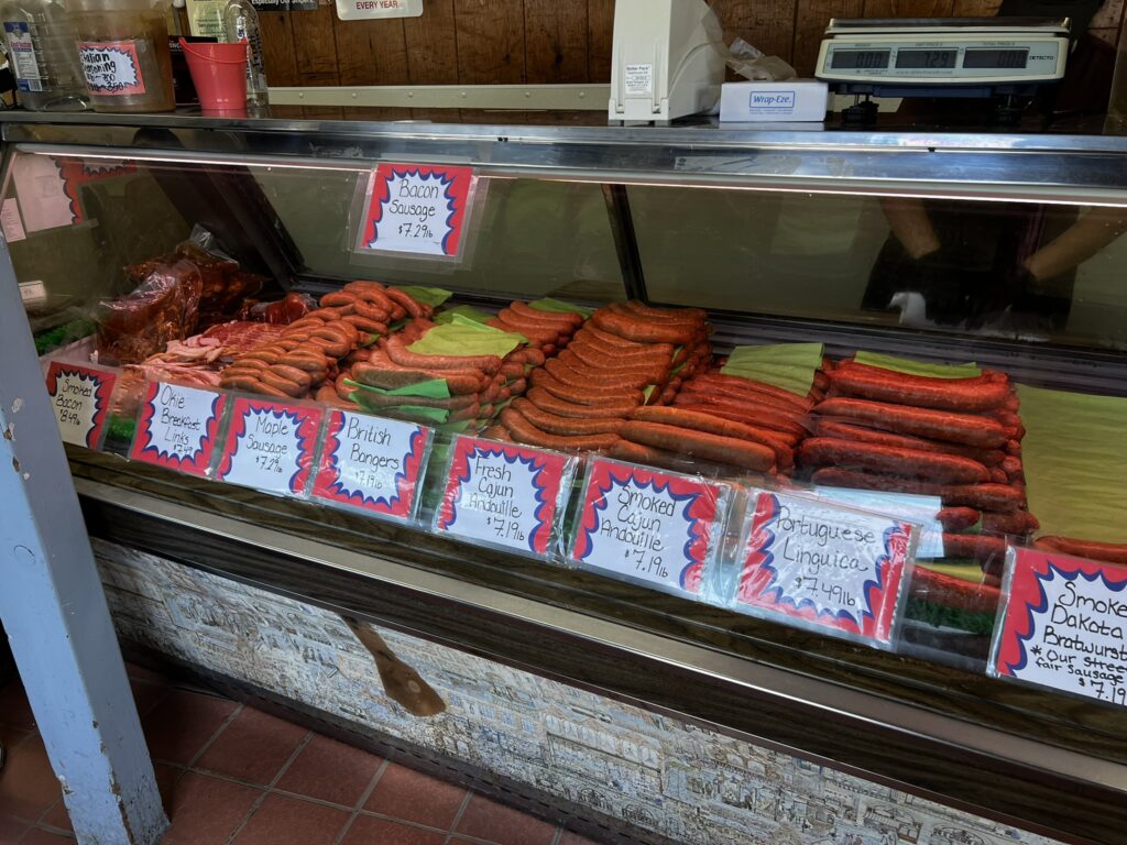 Lockeford Sausage meat case showcasing 50+ flavors priced at $7.19 per pound