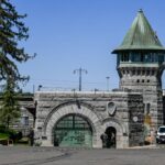 Granite East Gate and guard tower at Folsom State Prison, viewed from the public entrance.